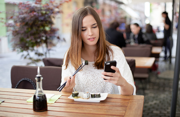 woman sharing what she is eating on iPhone