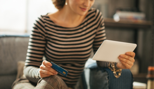 woman making a purcahase on a tablet app